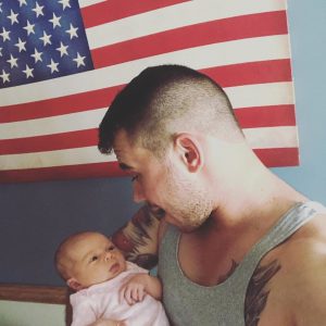 Alex Booth and his baby, who the police threatened to hand over to the notorious CPS